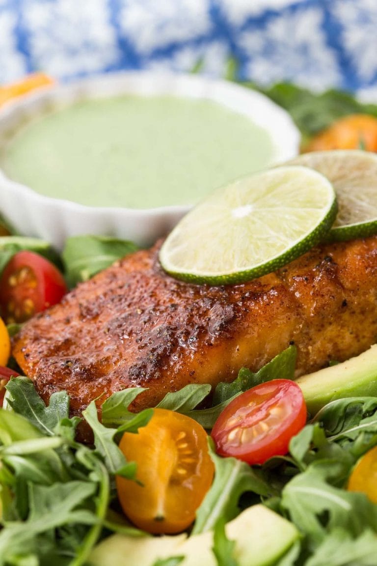 Vertical picture of Mexican Sugar Seared Salmon with dressing and salad