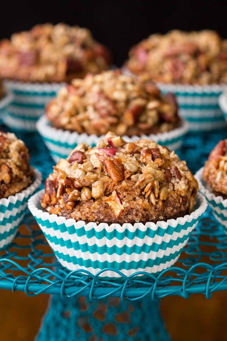 Morning Glory Muffins in blue and white wrappers on a blue cake stand.