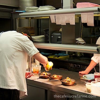 A photo of chefs preparing meals at Nopi Restaurant in London, England.