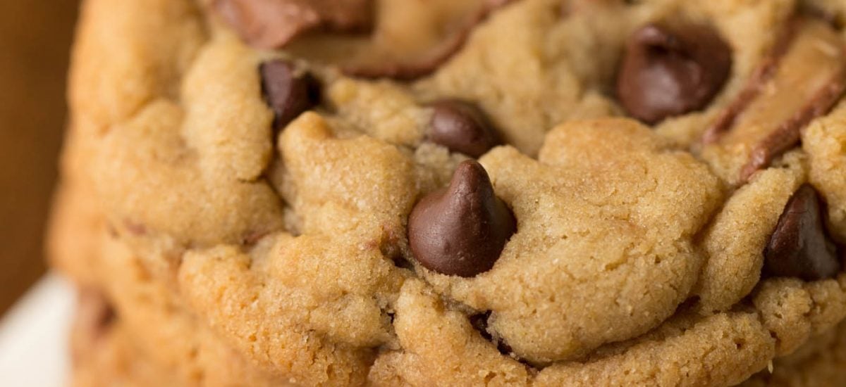 Overhead closeup of a stack of One Bowl Toffee Bar Chocolate Chip Cookies on a marble slab.