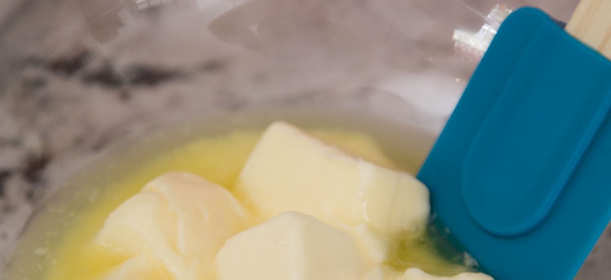 Shot of a bowl of partially melted butter, used in One Bowl Toffee Bar Chocolate Chip Cookies.