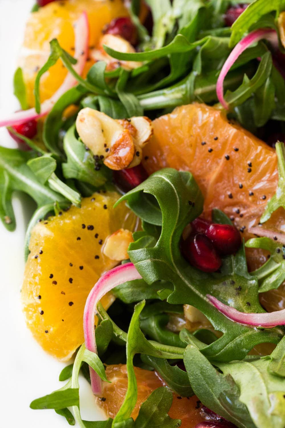 Arugula Orange Salad with Lemon Ginger Salad Dressing - this bright, fresh salad is loaded with delicious seasonal produce. It's sure to chase away the winter blues!