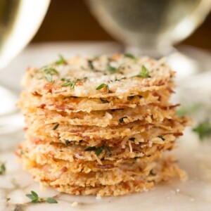Parmesan Crisps with Thyme and Sea Salt - one of the most elegant (and easy!) Italian-inspired appetizers you'll ever have the pleasure of meeting. A delicious little bite to go with cocktails, on salads or as a soup topping.
