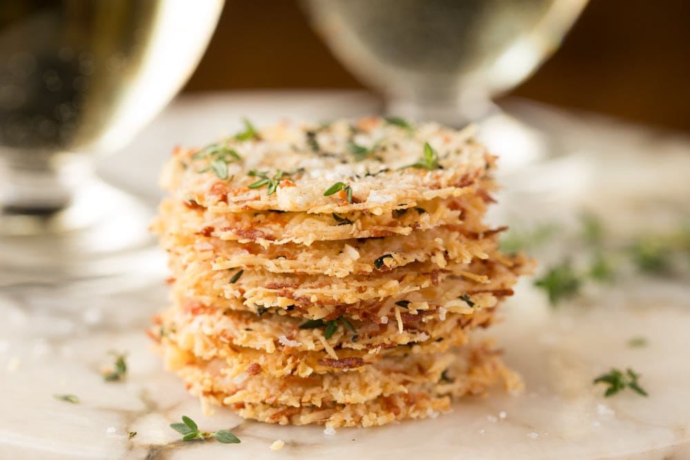 Parmesan Crisps with Thyme and Sea Salt - one of the most elegant (and easy!) Italian-inspired appetizers you'll ever have the pleasure of meeting. A delicious little bite to go with cocktails, on salads or as a soup topping. thecafesucrefarine.com