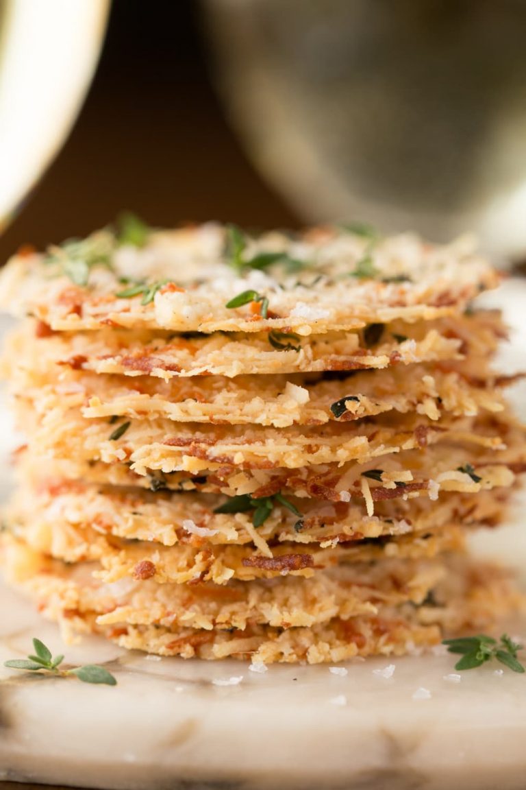 Parmesan Crisps with Thyme and Sea Salt - one of the most elegant (and easy!) Italian-inspired appetizers you'll ever have the pleasure of meeting. A delicious little bite to go with cocktails, on salads or as a soup topping.