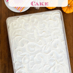 Overhead vertical photo of a One-Bowl No-Mixer Pumpkin Sheet Cake on a wood table.