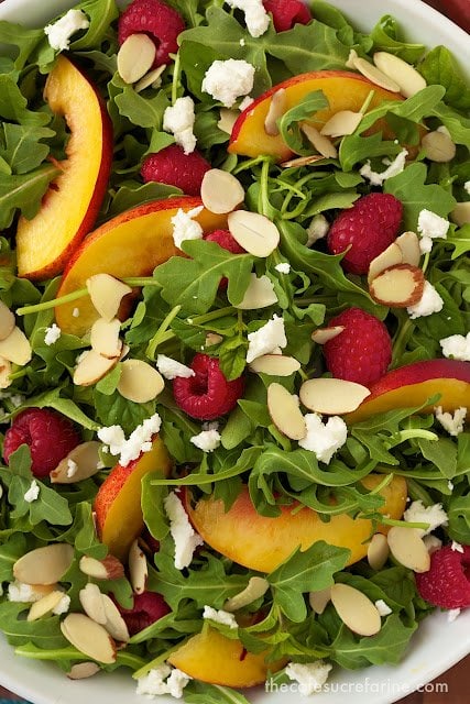 Overhead closeup photo of a dish of Raspberry Arugula Salad.
