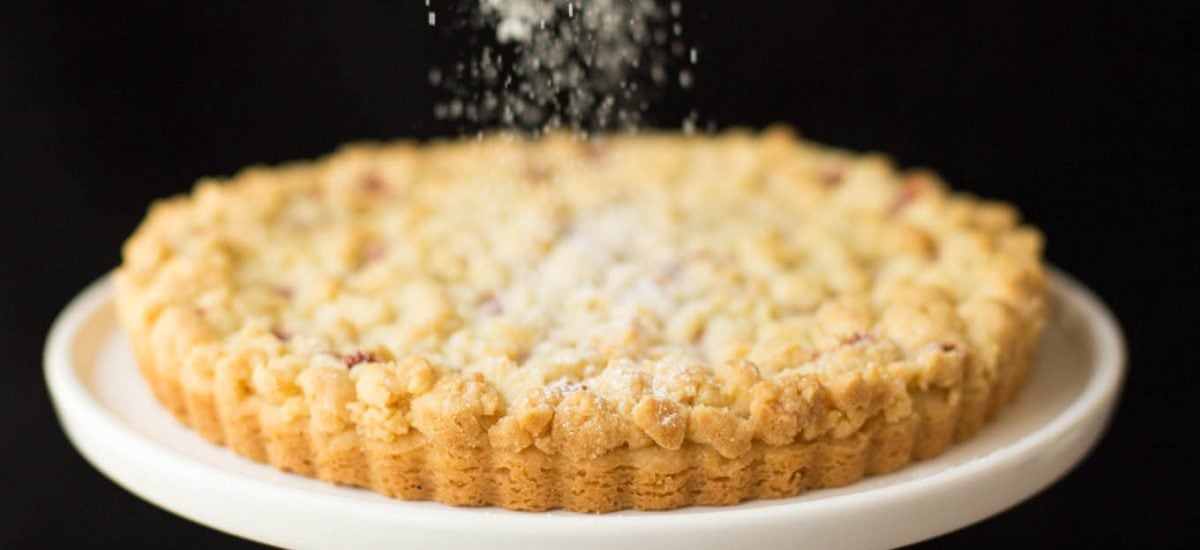 Raspberry Jam Shortbread Tart - with a layer of sweet raspberry jam nestled between the crisp, melt in your mouth shortbread crust and buttery crumble topping, this simple tart might be one of the most delicious desserts you'll ever have the pleasure of meeting!