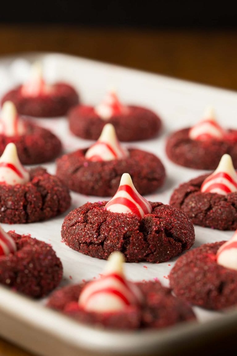 Red Velvet Kiss Cookies on a cookie sheet