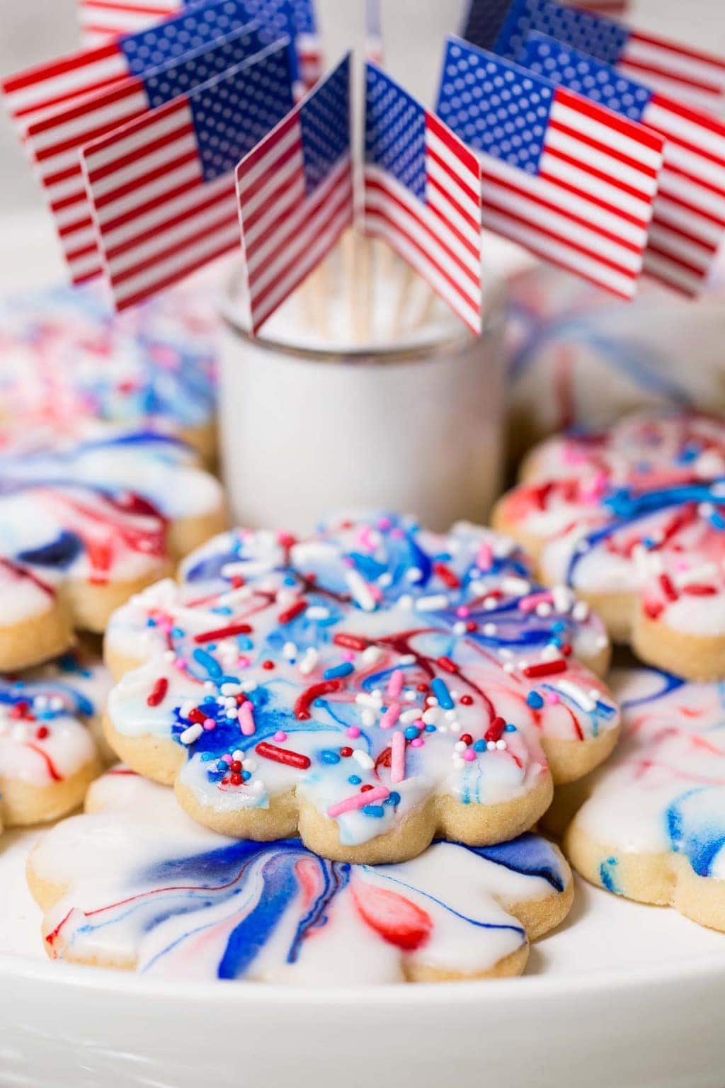 Vertical photo of Red, White and Blue Glazed Shortbread Cookies with American flags.