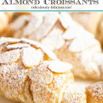 Vertical ultra closeup photo of a Ridiculously Easy Almond Croissant on a white glass platter sprinkled with powdered sugar.