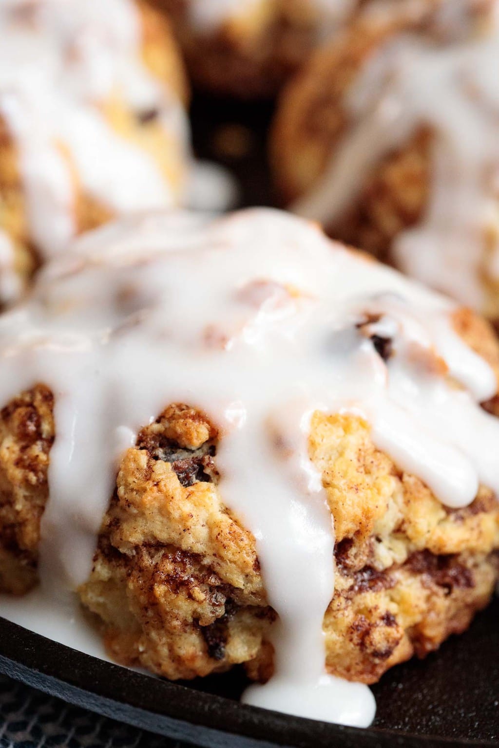 Ultra closeup photo of a Ridiculously Easy Cinnamon Raisin Buttermilk Biscuit.