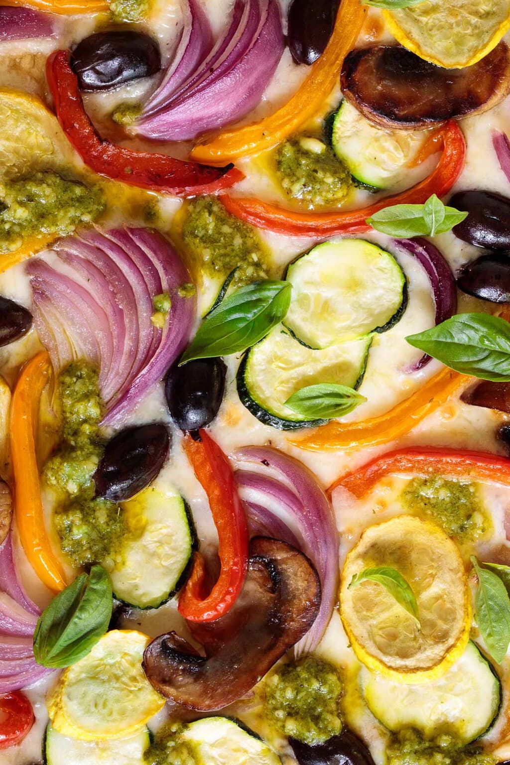 Ultra closeup of a Ridiculously Easy Roasted Veggie Pizza.