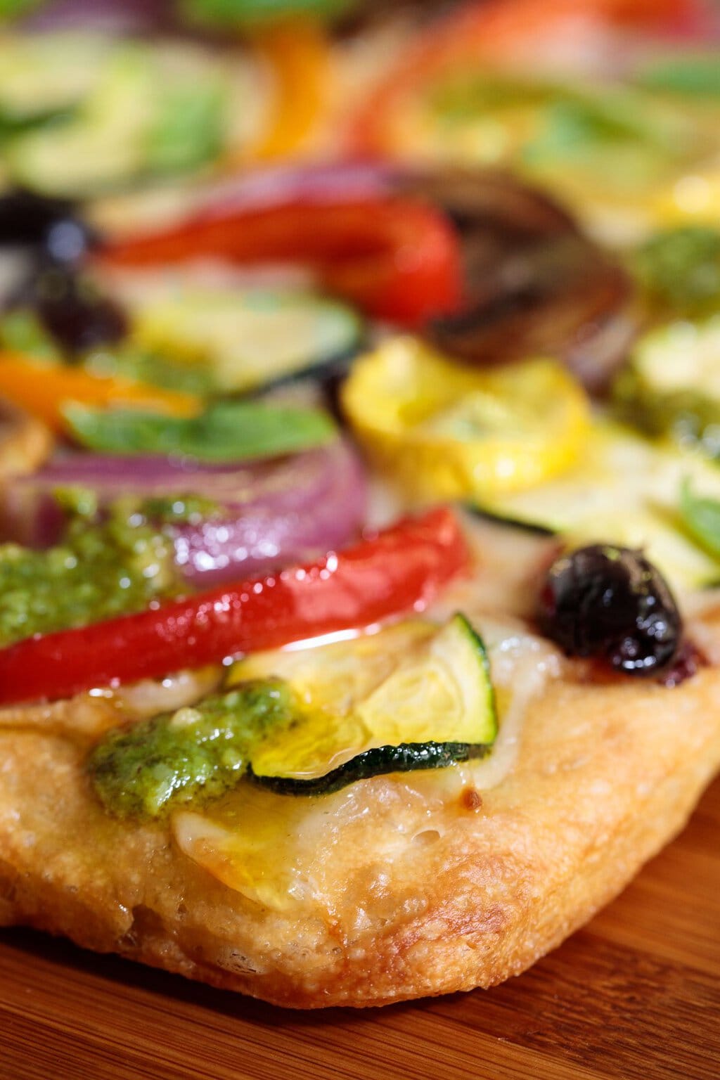 Closeup photo of the crust of a Ridiculously Easy Roasted Veggie Pizza.