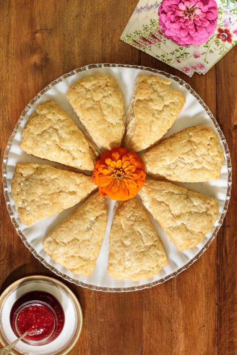 Overhead picture of sugar topped scones on a white platter