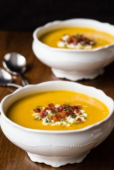 Vertical picture of Roasted Butternut Bacon Soup in white bowls