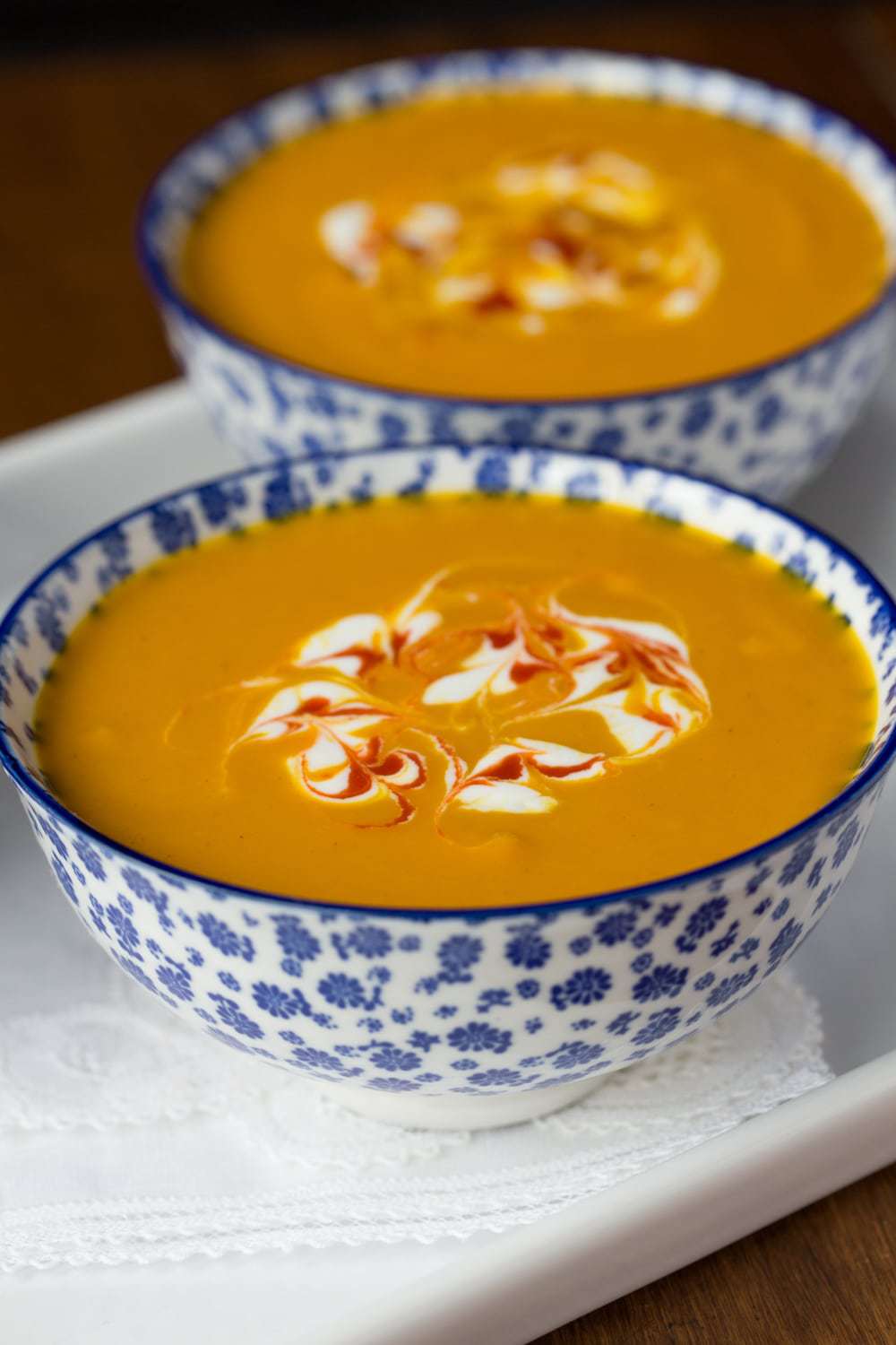 Roasted Thai Carrot and Sweet Potato Soup - if you love lots of flavor, but want to cut back a bit on calories, this delicious Thai-inspired soup is perfect for you! thecafesucrefarine.com
