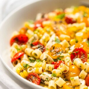 Close up vertical picture of Roasted Tomato Pasta in a white bowl