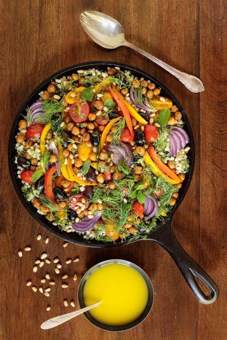 Overhead vertical photo of Roasted Veggie and Crispy Chickpea Salad in a cast iron skillet.