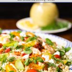 Vertical closeup photo of a platter of Israeli Couscous Salmon Salad.