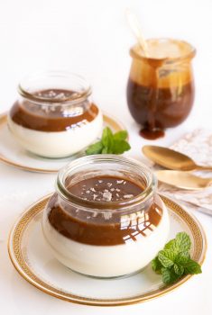 Vertical picture of salted butterscotch panna cotta in glass jars
