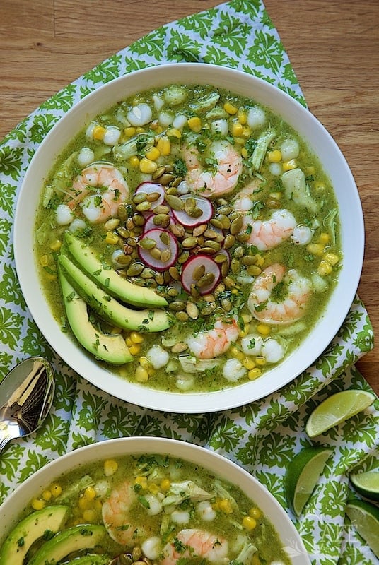 Overhead view of Shrimp and Chicken Pozolé Verde on a green cloth