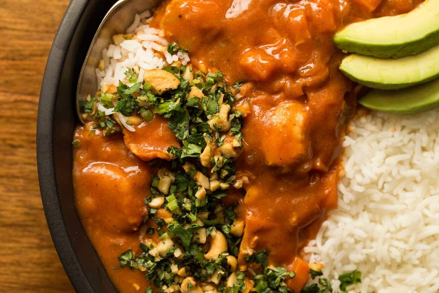 Extreme overhead closeup of a bowl of Slow Cooker Indian Butter Chicken.