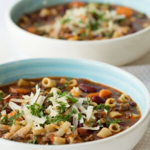 Vertical picture of Slow Cooker Pasta e Fagioli in white bowls