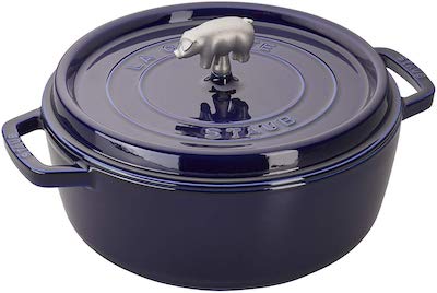 Stock photo of a Staub cast iron Dutch oven in navy.