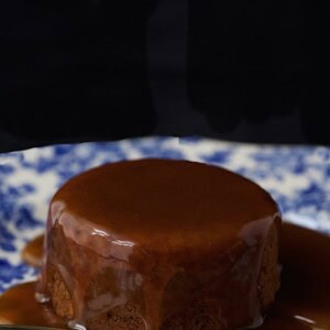 Sticky Toffee Pudding Cake - an iconic British treat that is beyond delicious. The cake is moist and full of flavor. The buttery toffee sauce is super easy to make.