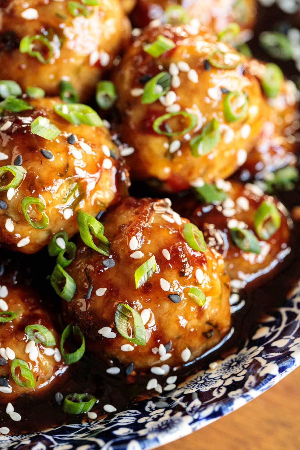 Extreme vertical closeup of a bowl of Strawberry Balsamic Glazed Chicken Meatballs.