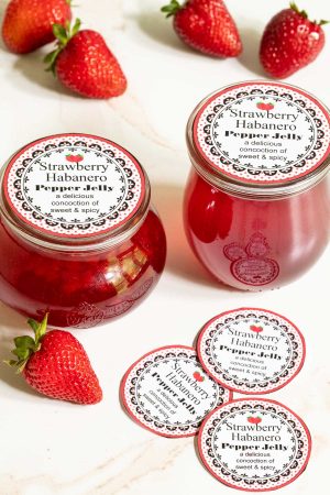 Strawberry Habanero Pepper Jelly in jars with labels.