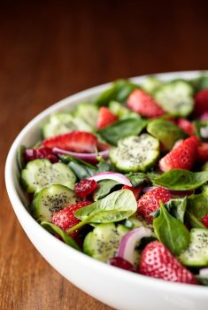 Vertical picture of Strawberry Spinach Salad in a white bowl
