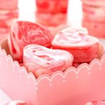 Vertical picture of heart shaped strawberry fudge in a pink and white box