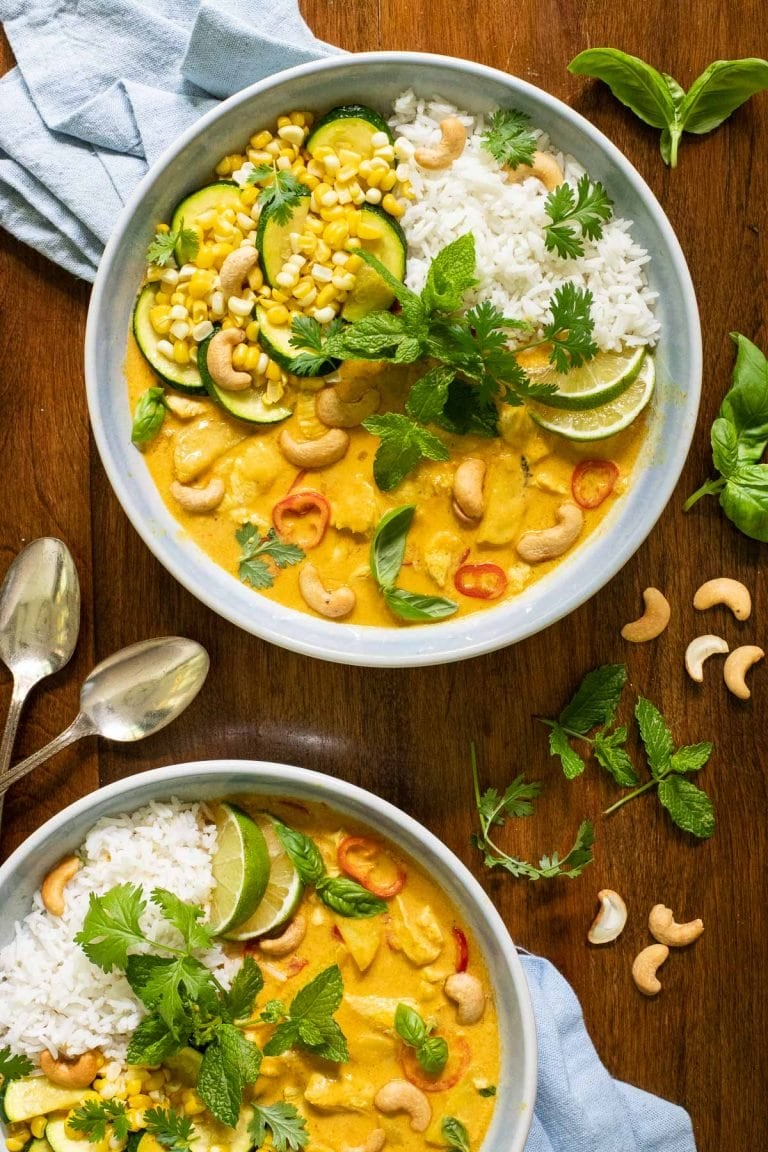 Overhead picture of Summery Chicken Coconut Curry on a wooden table