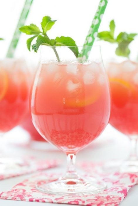 Vertical picture of Watermelon Mint Lemonade in glasses with green straws