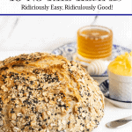 Vertical closeup photo of a loaf of Ridiculously Easy Seeded Focaccia Bread with a graphic title at the top of the picture, "Baking with Yeast - Ten No-Fail Recipes Ridiculously Easy, Ridiculously Good!"