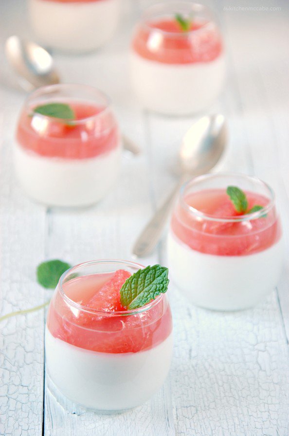 Picture of Coconut Panna Cotta with Grapefruit Gelee in small glass bowls on a white table