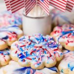 Vertical photo of Red, White and Blue Glazed Shortbread Cookies with graphics at the bottom of the photo.