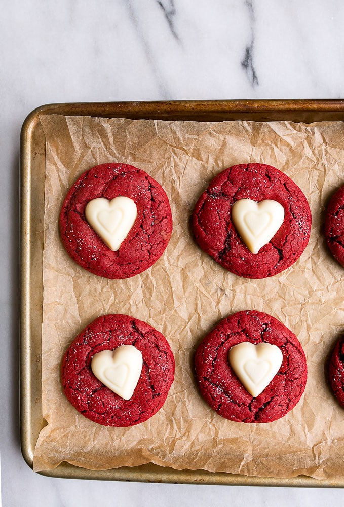 Overhead photo of Red Velvet Sugar Cookies on a cookie sheet from Dessert for Two website.