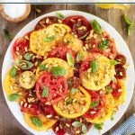 Vertical photo of a serving platter of Ballymaloe Summer Tomato Salad.
